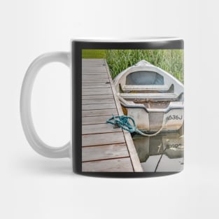 Boat tied to wooden staging on the Norfolk Broads Mug